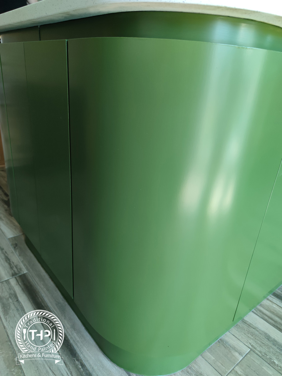 wide shot photo of hand painted white wood cabinets