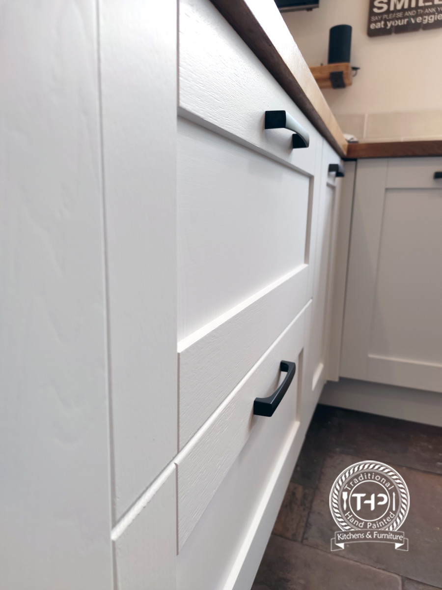 close up image of old cabinet handles